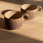 twee black coral mugs